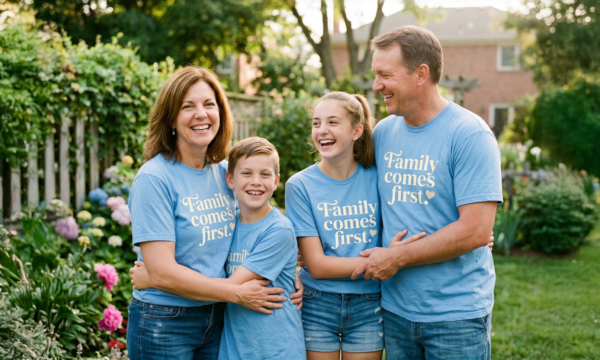 Family wearing matching t-shirts in a backyard garden